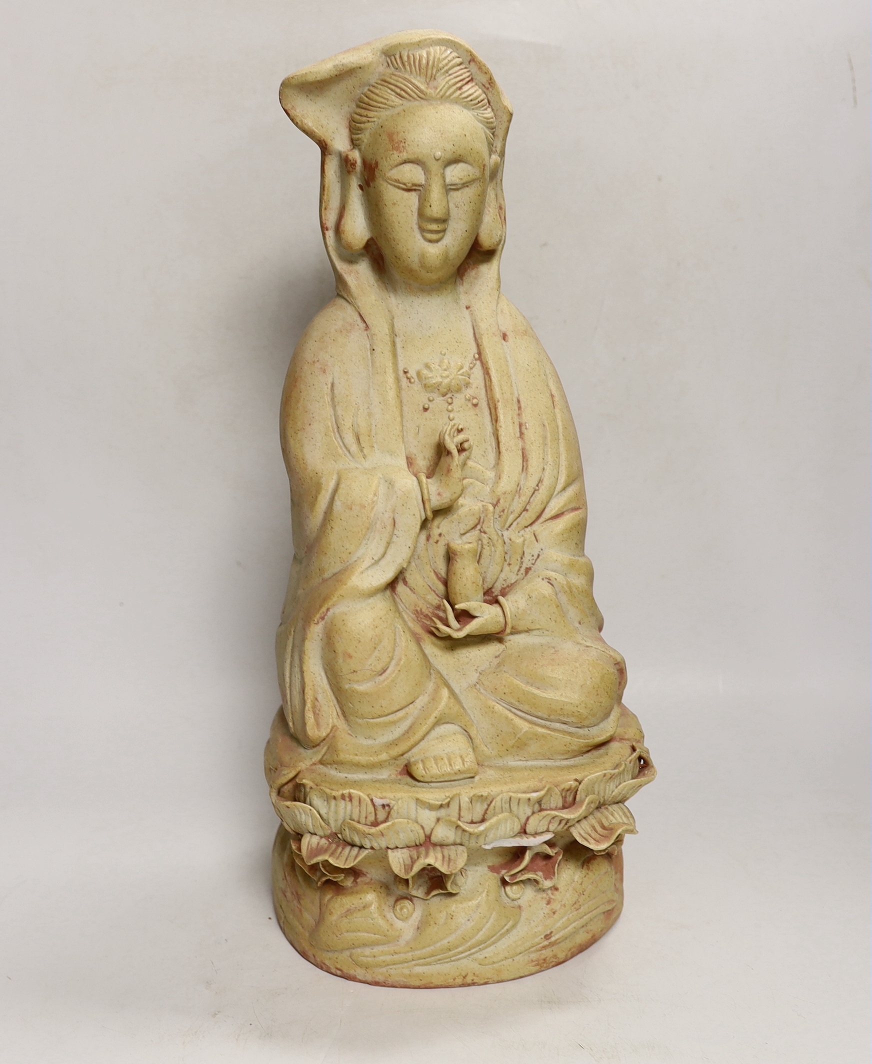 A Chinese biscuit figure of Guanyin, 38cm high